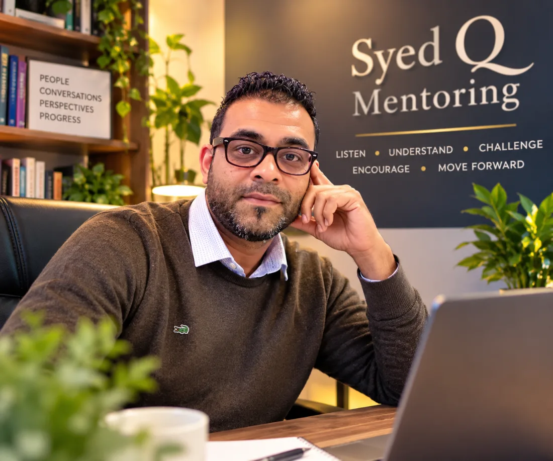 Syed, life coach at Syed Q Mentoring, seated at his desk